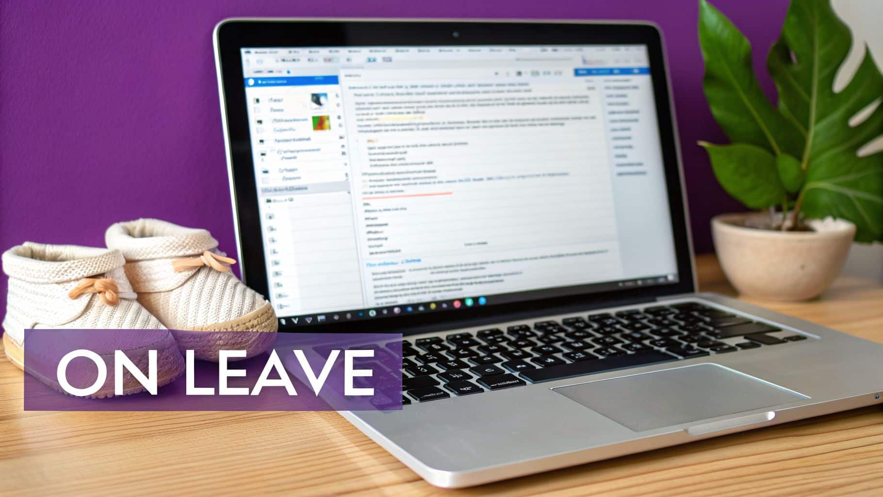 A laptop and baby shoes on a desk, with 'ON LEAVE' text, symbolizing parental leave.