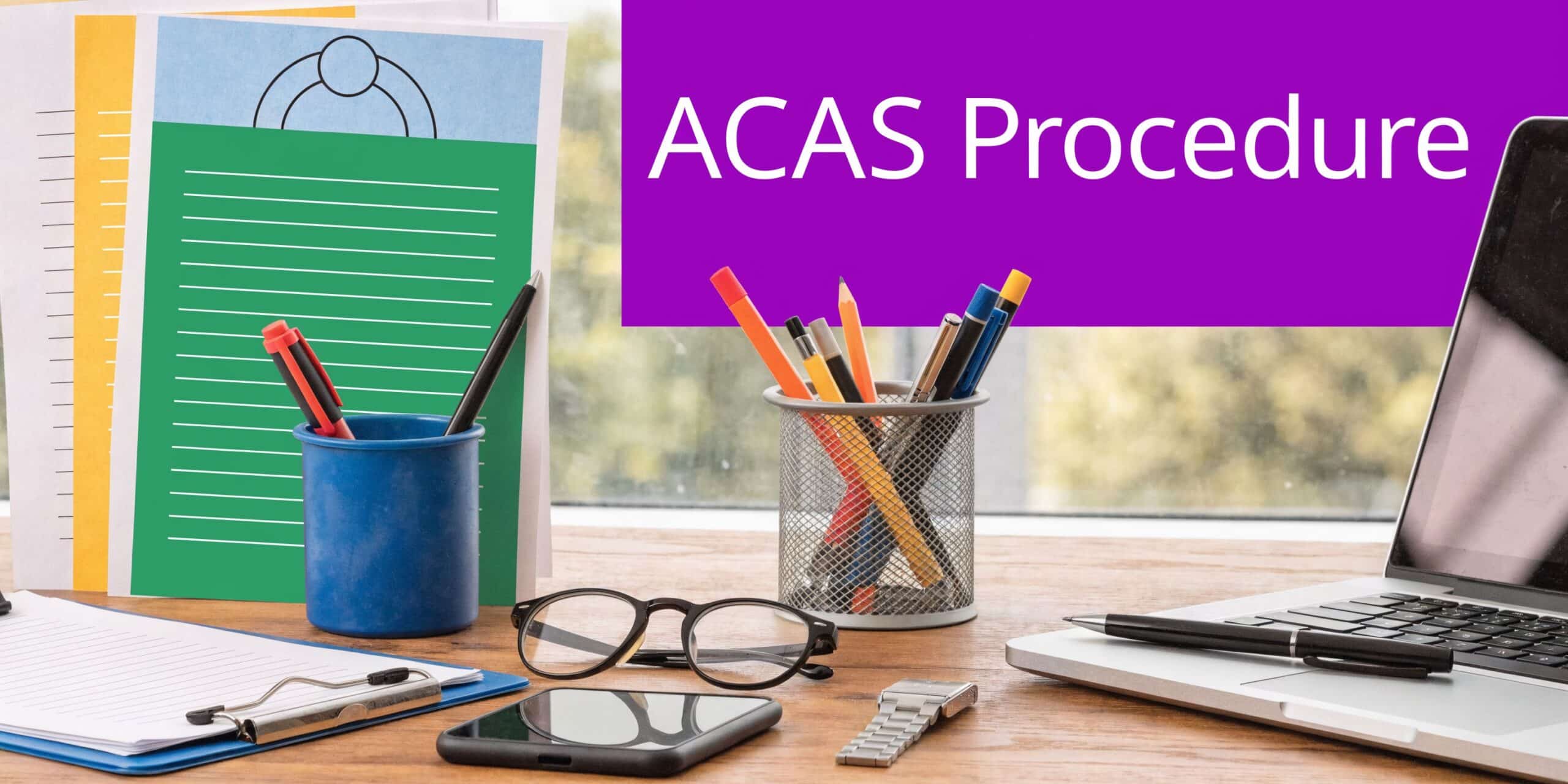 A professional office desk with a laptop, stationery, glasses, and a sign reading ACAS Procedure.